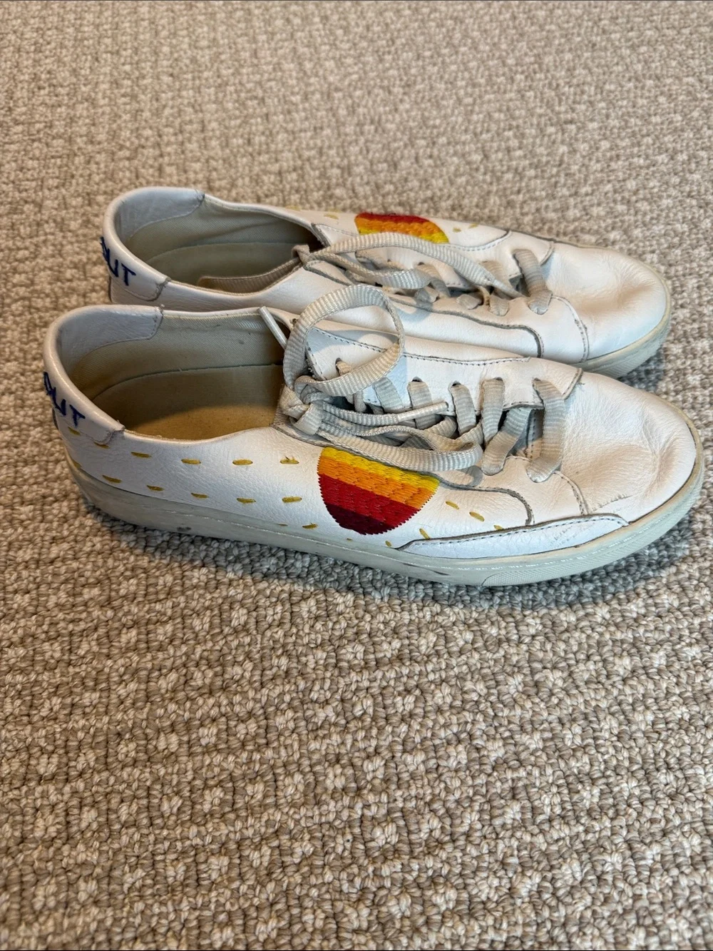 Soludos White Leather Sneakers with Red and Yellow Sunburst Detail